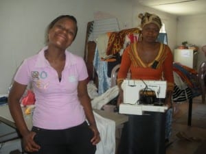 Our co-researcher, Bongi, (left) poses with a seamstress from Imiza Moyethu (right)