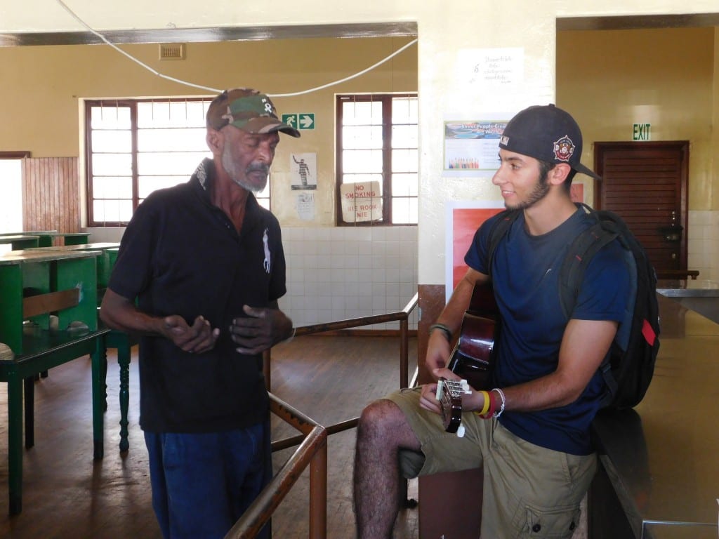 One of the co-researchers from the Khulisa team stopped by and discussed guitars with Drew.