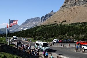 A line of visitors wait for the shuttles at Logan Pass in Glacier National Park on July 18, 2017. Greg Lindstrom | Flathead Beacon