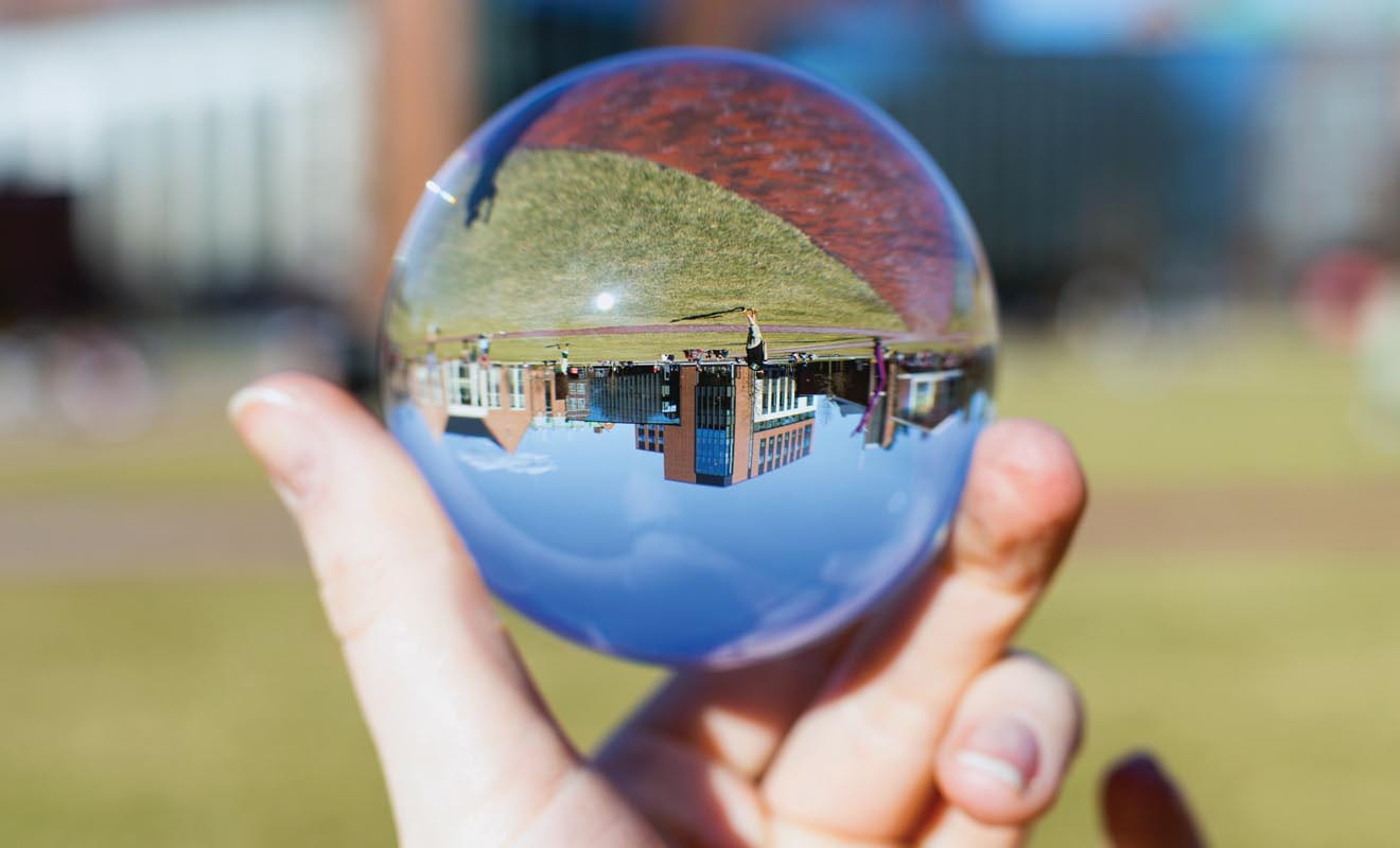 The WPI campus pictured upside down in globe.