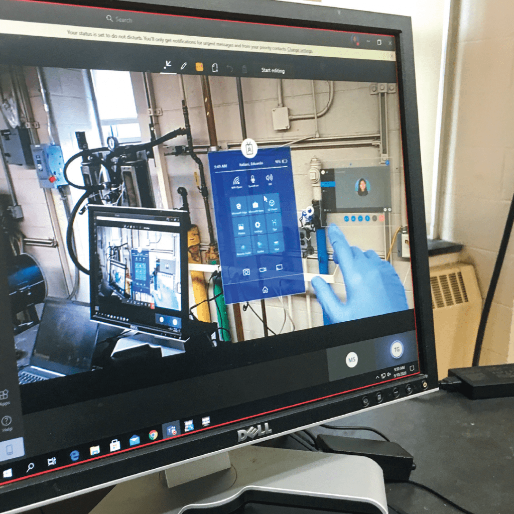 A computer monitor showing an augmented reality program that allows remote students to operate equipment in a chemical engineering lab