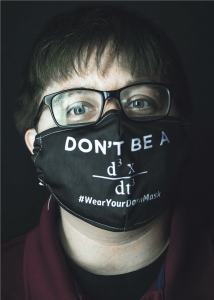 James Imperiali ’11, in glasses, wears a black face mask with the text, "Don't Be a d3 X / dt3, Wear a Darn Mask"