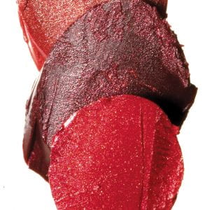 three overlapping chips of reddish make-up