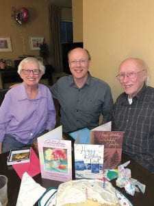Dave Farmer (center) with his parents at their 2019 birthday celebration.
