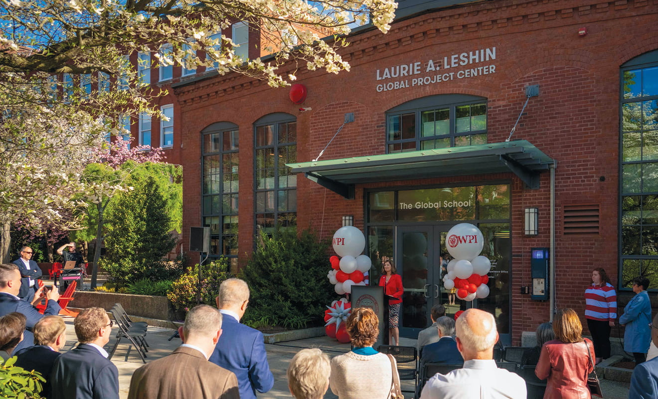 A group gathered for the of the new name of the Project Center Building: The Laurie A. Leshin Project Center