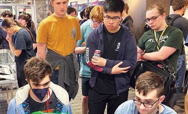 Students play vintage video games in Gordon Library