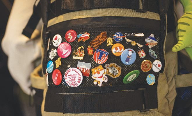 A backpack with pins